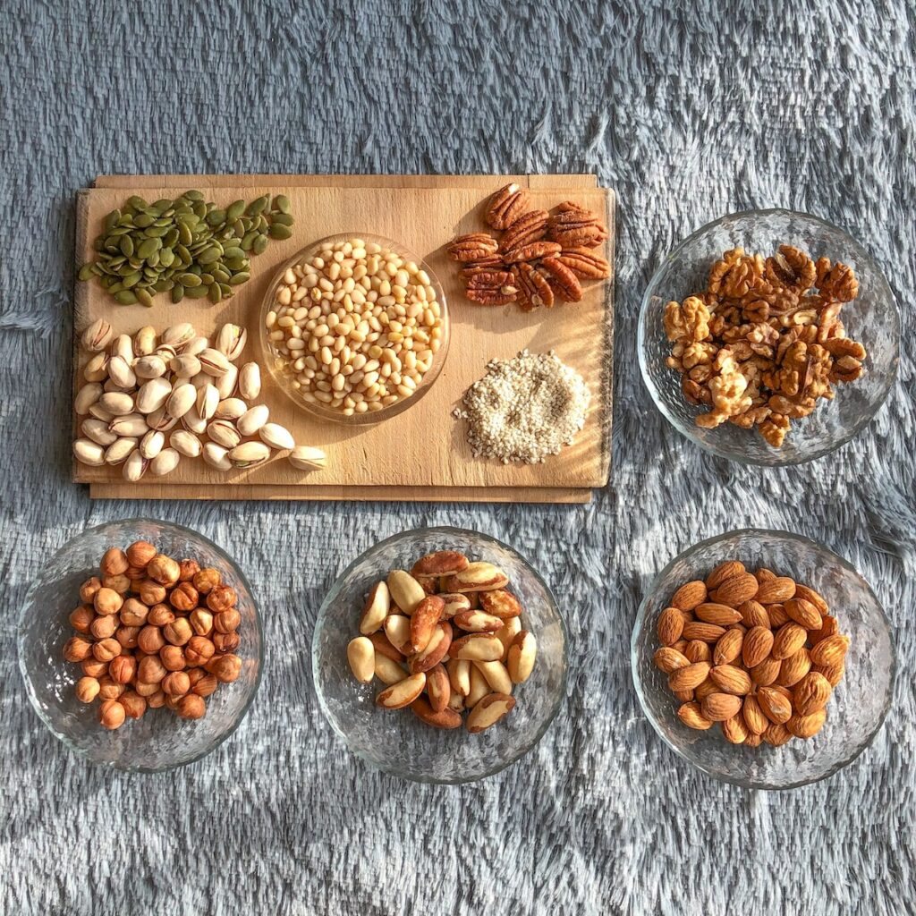 brown and white nuts on white ceramic bowls